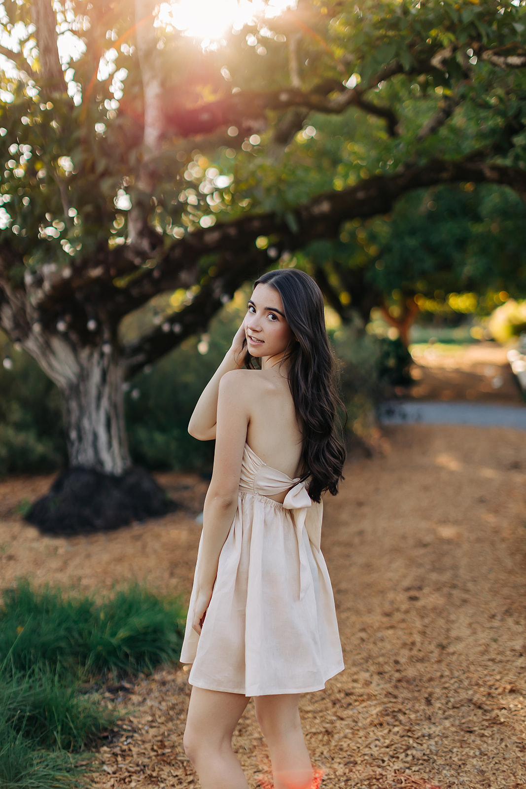 a girl posing in a park for her senior pictures